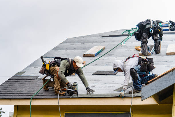Professional Roofing technician working in Vails Gate, NY